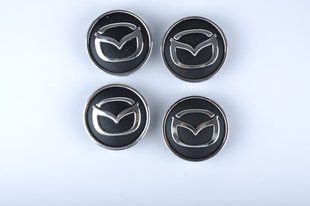 Ковпачки на литі диски / Заглушки диска Mazda 55/60мм (к-т 4шт.) 1481856173 фото